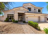 Charming two-story home featuring a three-car garage and beautiful landscaping at 5752 S Crossbow Pl, Chandler, AZ 85249