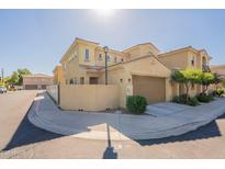 Charming townhome exterior with a private garage and well-maintained landscaping at 1367 S Country Club Dr # 1276, Mesa, AZ 85210