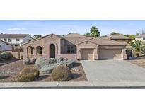 Charming single-story home boasting a spacious three car garage and well maintained desert landscaping at 2894 E Nolan Pl, Chandler, AZ 85249