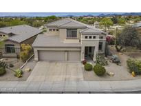 Beautiful desert-landscaped home boasts a three-car garage and a tile roof at 4864 E Eden Dr, Cave Creek, AZ 85331