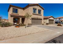 Charming two-story home with a two-car garage, covered entry, and desert landscaping at 1472 E Avenida Kino --, Casa Grande, AZ 85122