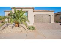Charming single-Gathering home featuring a well-maintained yard and a two-car garage at 36169 N Serrano Ave, Queen Creek, AZ 85140
