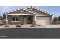 Charming single-story home with a two-car garage, desert landscaping, and a classic Southwestern design at 15777 W Cheryl Dr, Waddell, AZ 85355