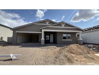 Charming single-Gathering home featuring a welcoming porch and an attached garage at 15777 W Cheryl Dr, Waddell, AZ 85355