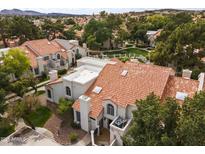 Scenic aerial view of charming residences with terracotta roofs nestled amidst lush greenery and community green spaces at 1717 E Union Hills Dr # 1110, Phoenix, AZ 85024