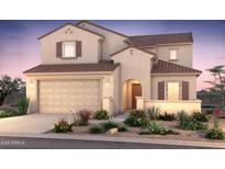Charming two-story home featuring a warm color palette, tiled roof, and well-maintained landscaping at 17822 W Encinas Ln, Goodyear, AZ 85338