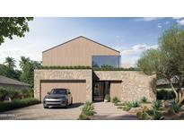 Modern home with a stone facade, wooden upper level, and neat landscaping at 3828 E Monterosa St, Phoenix, AZ 85018