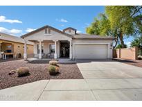 Inviting single-story home featuring a covered front porch, low maintenance landscaping, and a two-car garage at 4606 S Marron --, Mesa, AZ 85212