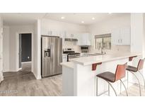 Well-equipped kitchen with stainless steel appliances, breakfast bar, and ample counter space at 5450 E Deer Valley Dr # 3023, Phoenix, AZ 85054
