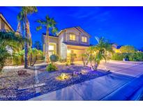 Beautiful home featuring mature palm trees, professionally landscaped yard, and a spacious driveway at 3270 W White Canyon Rd, San Tan Valley, AZ 85144