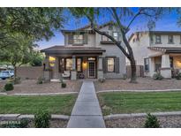 Charming two-story home featuring a cozy front porch and well-maintained landscaping at 3678 E Yeager Ct, Gilbert, AZ 85295
