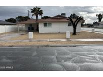 Charming single-story home featuring a palm tree and a covered parking area at 4701 N 39Th Dr, Phoenix, AZ 85019