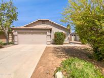 Charming single-story home with a well-manicured front yard and attached two-car garage at 1488 W Page Ave, Gilbert, AZ 85233