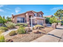 Charming two-story home features a landscaped yard, stone accents, and a spacious garage at 15009 S 47Th St, Phoenix, AZ 85044
