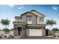 Charming two-story home featuring a gray facade, brick accents, and a two-car garage, all under a clear blue sky at 1571 E Tiffany Way, Gilbert, AZ 85298