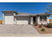 Charming single-story home featuring a three-car garage and desert landscaping at 1644 E Joelle Dr, Casa Grande, AZ 85122