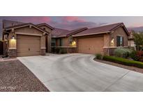Stunning exterior with a spacious driveway and well-maintained landscaping at 18368 W Long Lake Rd, Goodyear, AZ 85338