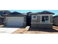 Single-story home featuring a gray exterior, attached two-car garage and low maintenance desert landscaping at 19039 W Rose Ln, Waddell, AZ 85355