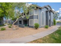 Inviting apartment featuring a charming patio and well-maintained landscape with walkway at 255 S Kyrene Rd # 212, Chandler, AZ 85226