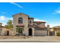 Charming two-story home featuring a tile roof and attached two-car garage at 5222 W El Cortez Trl, Phoenix, AZ 85083