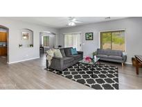 Stylish living room with modern furnishings, hardwood floors, and ample natural light at 6626 W Laurel Ave, Glendale, AZ 85304