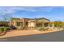 Charming single-story home with well-manicured desert landscaping and a spacious driveway and attached two-car garage at 16010 E Summit View Dr, Fountain Hills, AZ 85268