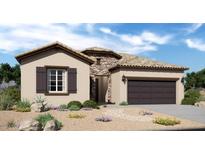 Charming single-story home with stone accents, a two-car garage, and desert landscaping at 20445 W Rovey Ave, Buckeye, AZ 85396