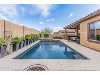 Inviting backyard features a sparkling pool, raised spa, and covered patio for outdoor entertainment at 10713 N 124Th Pl, Scottsdale, AZ 85259