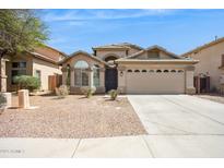 Charming single-story home with desert landscaping and a two-car garage at 11351 N 153Rd Dr, Surprise, AZ 85379