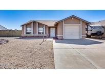 Charming single-story home with a gravel front yard and a convenient attached garage at 3339 W Mohawk Ln, Phoenix, AZ 85027