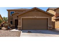 Charming home featuring a two-car garage and landscaped front yard at 4659 E Pinto Valley Rd, San Tan Valley, AZ 85143