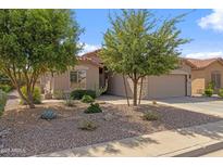 Charming home featuring low maintenance desert landscaping and a two-car garage at 4932 S Verbena Ave, Gilbert, AZ 85298