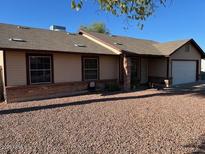 Charming single-story home featuring a well-maintained exterior and low-maintenance desert landscaping at 637 E Kramer St, Mesa, AZ 85203