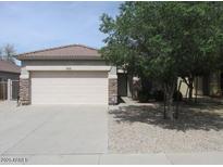 Well-maintained single-story home featuring a two-car garage and low-maintenance landscaping at 10028 E Kilarea Ave, Mesa, AZ 85209