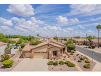 Charming single-Gathering home with a well-manicured front yard and a three car garage at 1919 S Granite St, Gilbert, AZ 85295