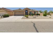 Charming single-story home featuring a two-car garage and desert landscaping for low maintenance at 28942 N Lazurite Way, San Tan Valley, AZ 85143