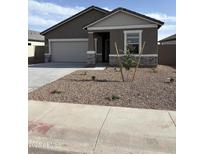 Attractive single-story home featuring desert landscaping, a two-car garage, and a welcoming covered entrance at 3967 E San Jose St, San Tan Valley, AZ 85143