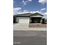 Charming single-story home featuring a two-car garage, neutral tones, and well-maintained landscaping at 4128 E Kolin Ln, San Tan Valley, AZ 85143
