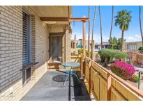 Relaxing balcony with small table offering a cozy outdoor space with exterior views at 6928 E 3Rd St, Scottsdale, AZ 85251