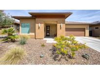 Charming single-story home featuring a low-maintenance desert landscape and a covered front porch at 13204 W Via Dona Rd, Peoria, AZ 85383
