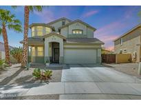 Charming two-story home with desert landscaping, a two car garage and a welcoming front entrance at 2850 N 152Nd Ln, Goodyear, AZ 85395