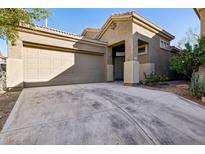 Charming single-story home with desert landscaping, a two-car garage, and a covered front entry at 4031 E Barwick Dr, Cave Creek, AZ 85331
