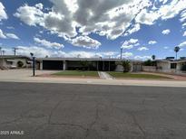 Charming home featuring a landscaped front yard and inviting walkway at 6207 W Orange Dr, Glendale, AZ 85301