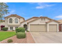 Charming home featuring a neutral color scheme, tile roof, and a well-manicured front yard at 844 E San Remo Ave, Gilbert, AZ 85234