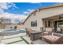 A private outdoor living space with pool, spa, patio, and fire pit at 1078 W Redwood Ave, Queen Creek, AZ 85140