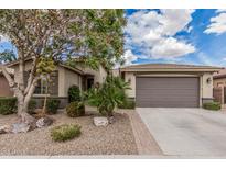 Charming single-story home features desert landscaping and a spacious two-car garage at 1078 W Redwood Ave, San Tan Valley, AZ 85140
