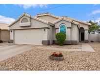 Charming single-story home featuring a well-manicured yard, neutral tones, and an attached two-car garage at 1770 W Derringer Way, Chandler, AZ 85286