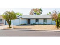 Charming single-story home with a well-maintained front yard and mature landscaping at 313 E Westchester Dr, Tempe, AZ 85283
