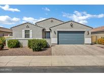 Charming single-story home with a grey exterior, well-maintained landscaping, and a spacious two-car garage at 4140 E Caitlin Dr, San Tan Valley, AZ 85140