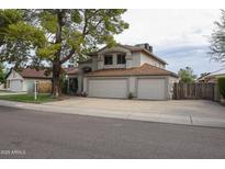 Charming two-story home with a spacious three car garage and mature landscaping at 4423 W Escuda Dr, Glendale, AZ 85308